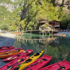 Shala River Tour from Komani Lake 1 Komani Lake to Shala River Tour. Experience a scenic boat ride through crystal-clear waters. Glide along emerald rivers and majestic canyons for a truly unforgettable adventure.